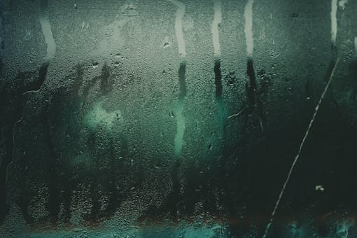 Water condensation and moisture on a surface illustrating the humidity problems a dehumidifier solves